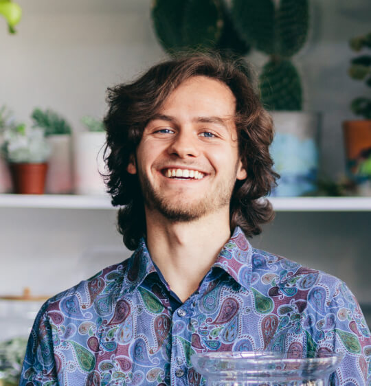 happy-man-with-plants-in-glass-jar-2022-03-04-05-53-44-utc.jpg